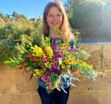  Melanie and her daughter (pictured) create beautiful native flower bouquets from their verge garden