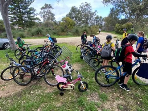 Students parking their bikes and getting ready for a fun Friday of learning