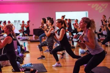 Photo of three people in a fitness class