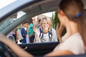 Parent dropping off a child at school