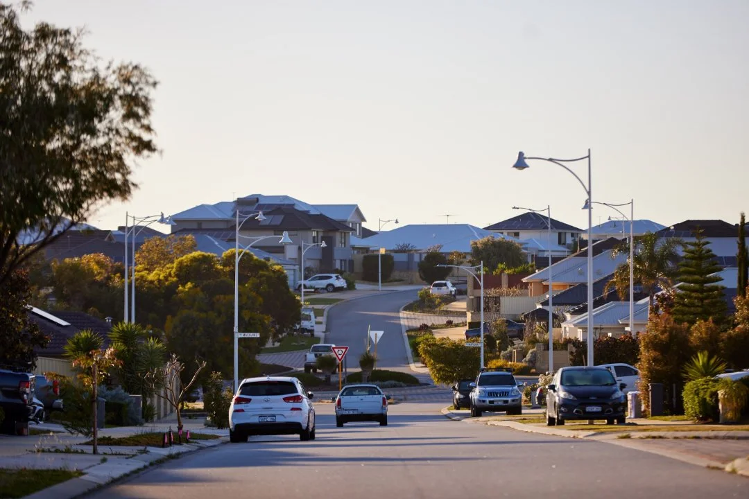 Photo of suburban housing with street lights