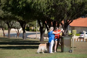 Photo of people disposing of waste