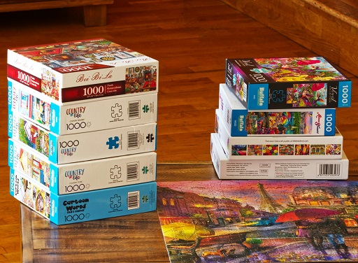 Boxes of jigsaws on a table