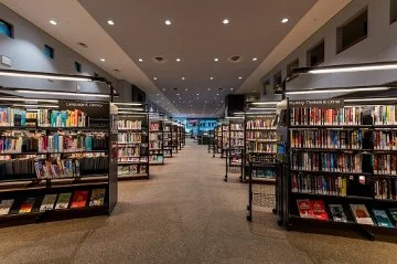 Lots of shelves in a well-stocked library