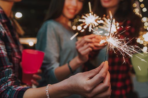 New years eve with people holding sparklers