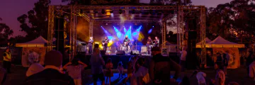 Photo of the stage with a band at Music in the Park